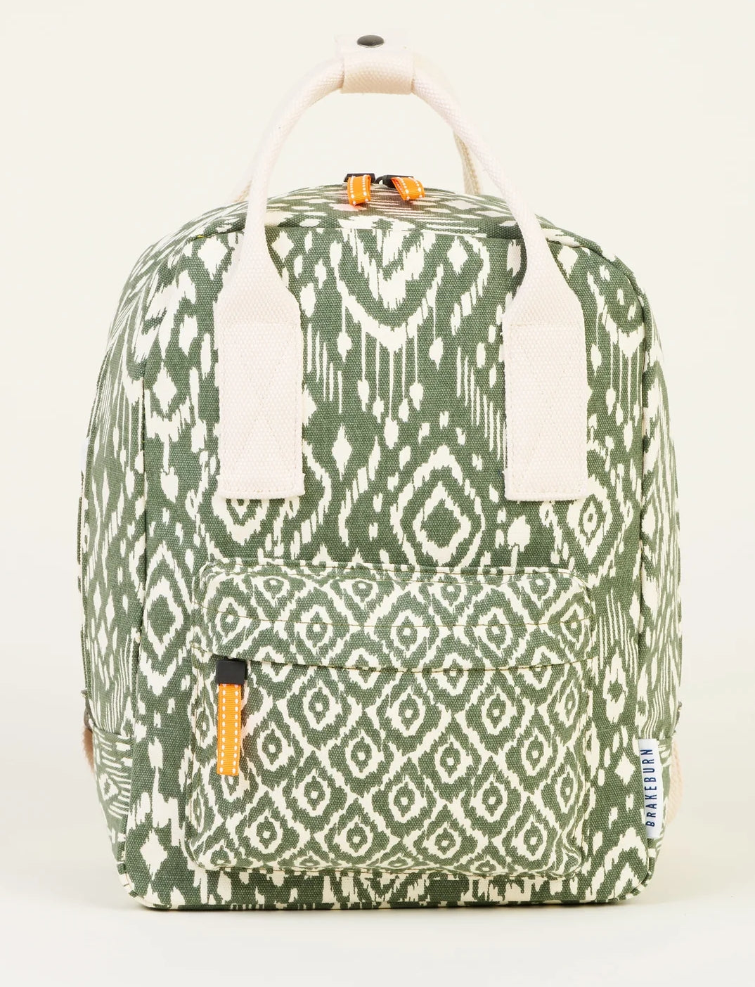 Small backpack from Brakeburn in the Ikat Mix style with a Khaki Aztec style pattern, back straps and top carry handles.