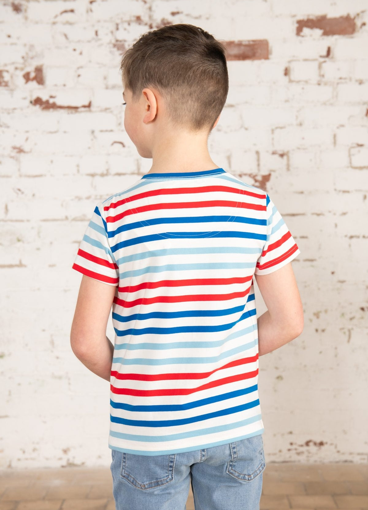 Lighthouse kids Oliver short sleeve t-shirt in white, blue and red stripe pattern with tractor applique.