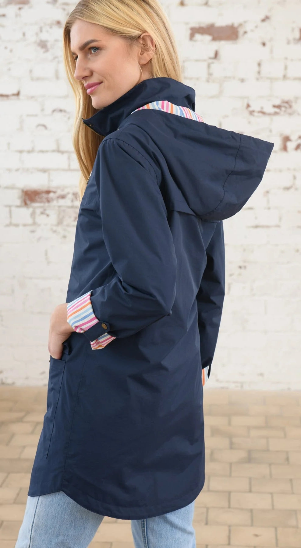 Waterproof women's hip length Rebecca jacket from Lighthouse in Navy.