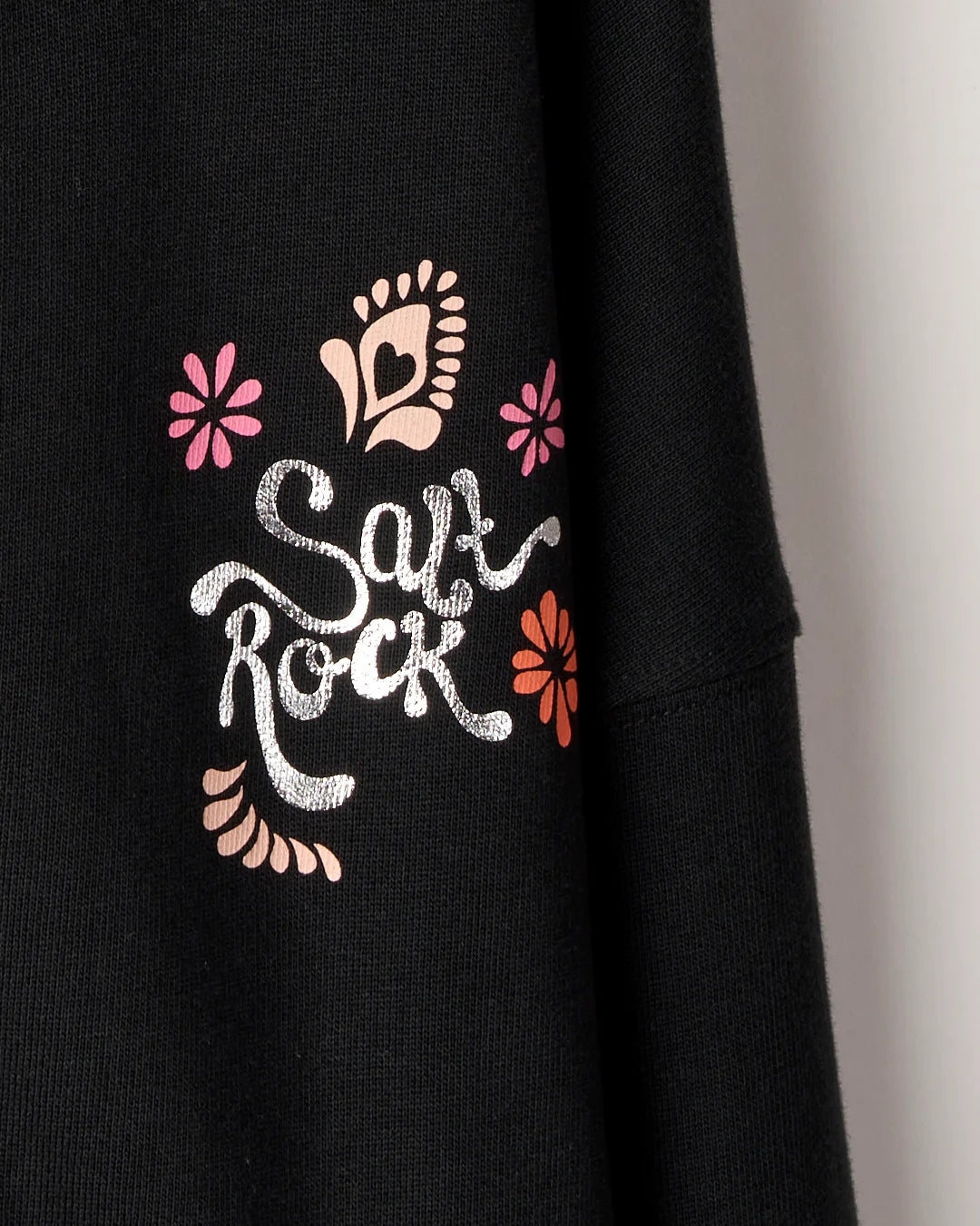 Kid's Saltrock black Tahiti Van full zip hoodie with metallic silver floral logo print on the front.Kid's Saltrock black Tahiti Van full zip hoodie with metallic silver floral logo print on the front.