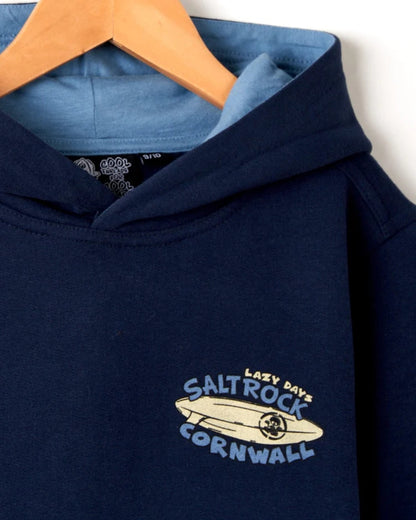 Kids Saltrock Lazy Days Cornwall printed Navy hoodie with large print on the back and smaller surfboard print on the front.