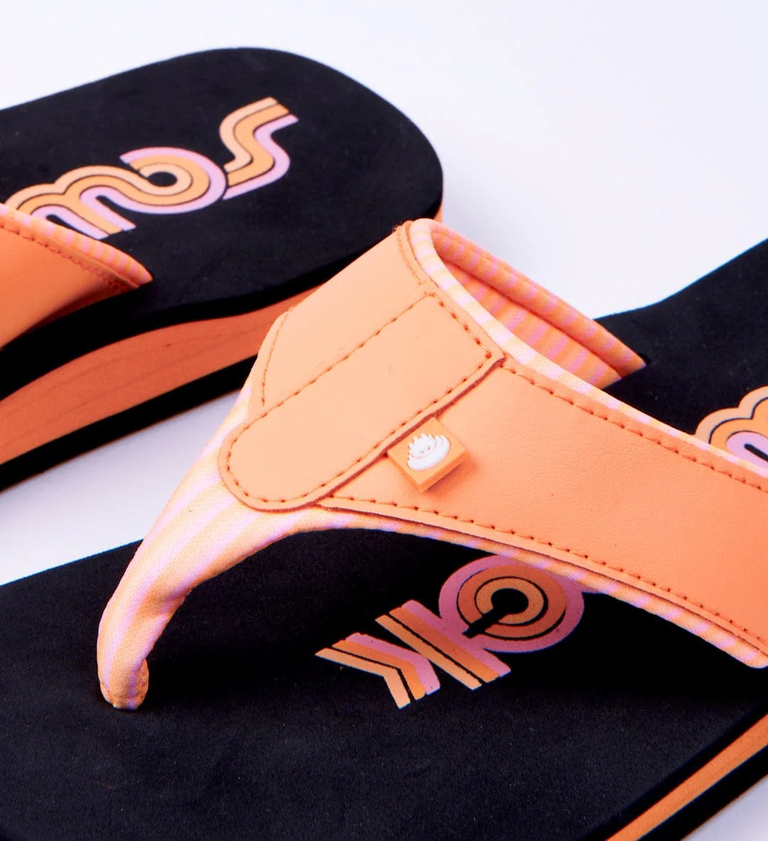 Black and peach coloured Cora Retro women's flip flops from Saltrock with a padded strap and toepost.